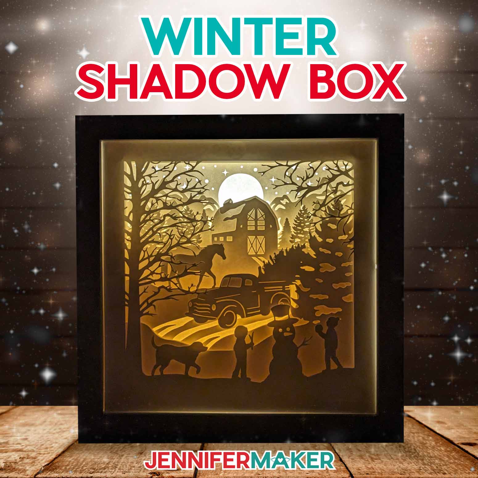 Learn to reinforce intricate paper cuts with vinyl in Jennifer Maker's winter shadow box tutorial! A glowing cardstock shadowbox featuring a winter scene with a barn, truck, horse, and children building a snowman (with the help of their dog) illuminates a dark room.