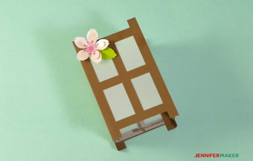Decorating the Japanese paper lantern with spring flowers