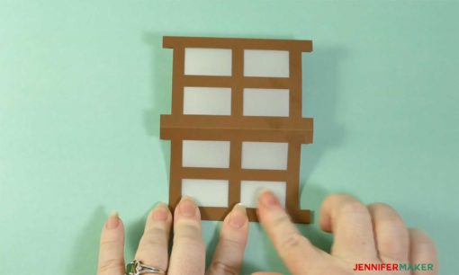 Folding the Japanese paper lantern in half and pressing while the glue sets