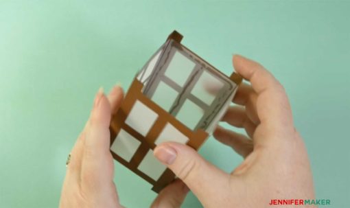 Opening up the folded Japanese paper lantern