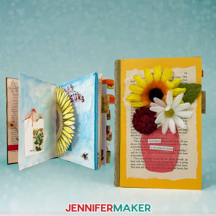 Two handmade junk journals decorated with paper flowers. One is open to reveal an eclectic mix of scraps inside. Learn how to Make Junk Journals in the free tutorial