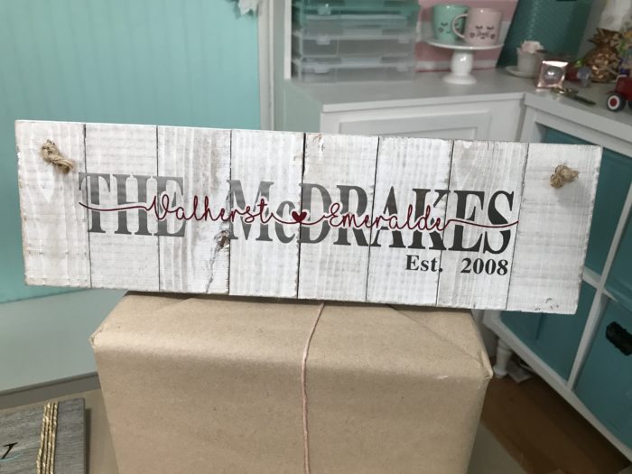 Knockout Design Sign with last and first names made on a Cricut