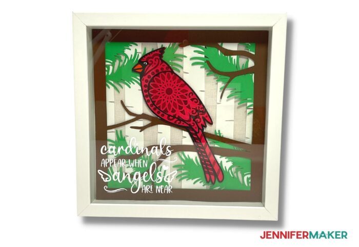 Cardsock layered cardinal SVG project in a white shadow box frame.