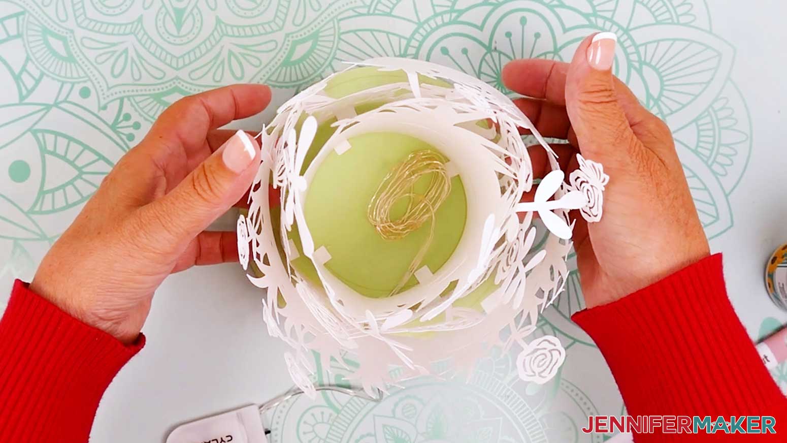 Gently place the outer layer on the base and carefully make sure the elements do not tangle on each other.