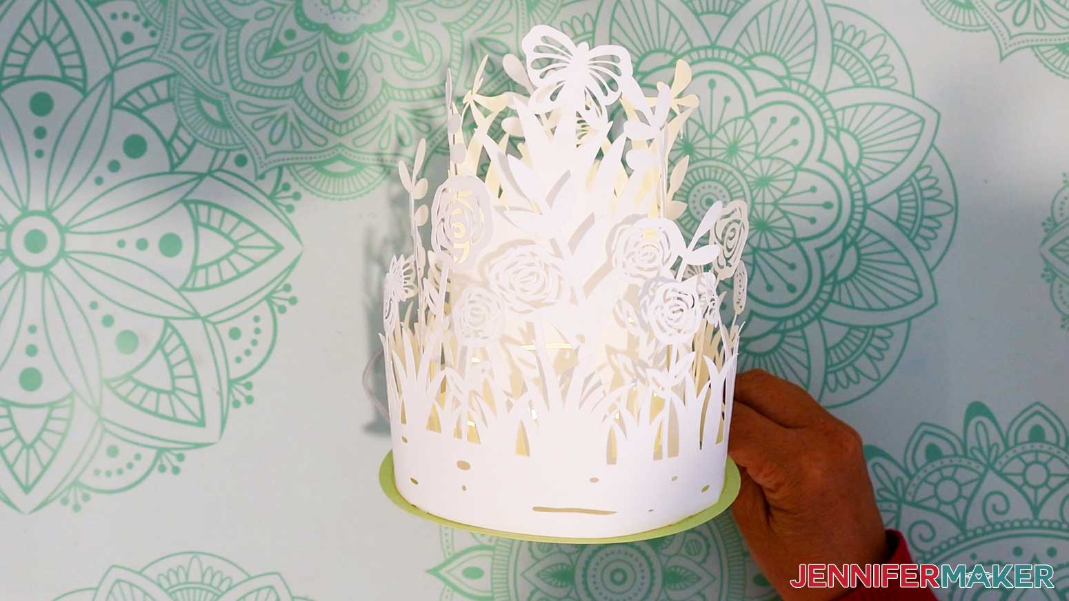 Complete layered garden lantern with fairy lights turned on.