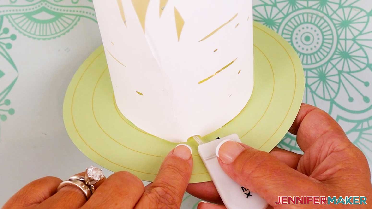 Feed the fairy lights under the edge of the innermost layer and strand through the cutout.