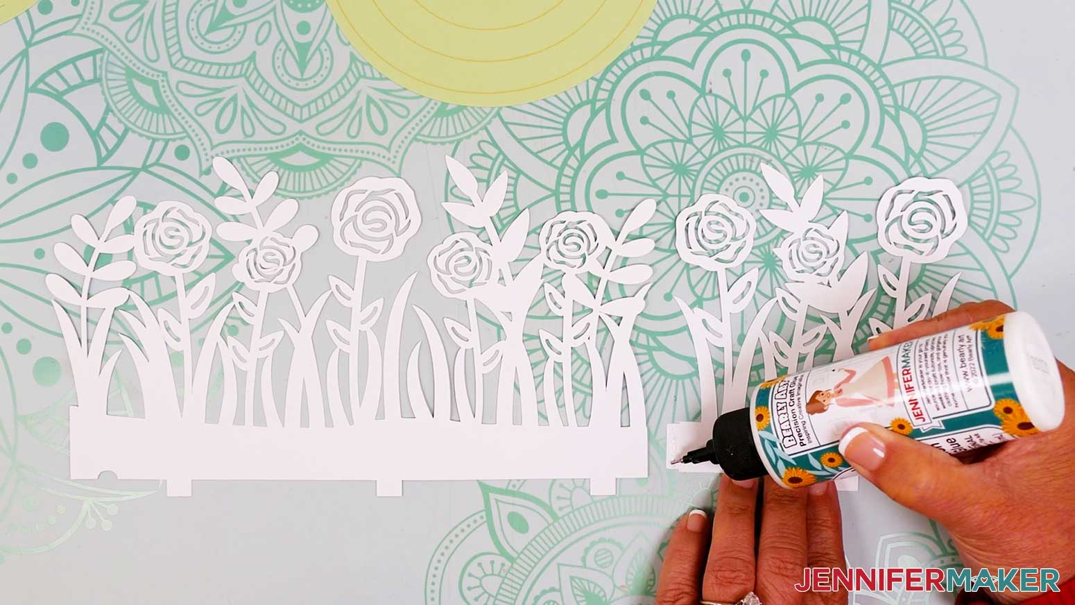 Apply glue along the right edge of the longer middle lantern section and attach it to the shorter section.