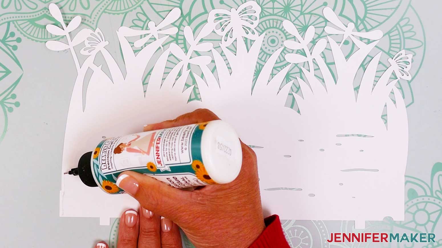 Apply a thin line of glue along the edge of the large innermost garden lantern layer.