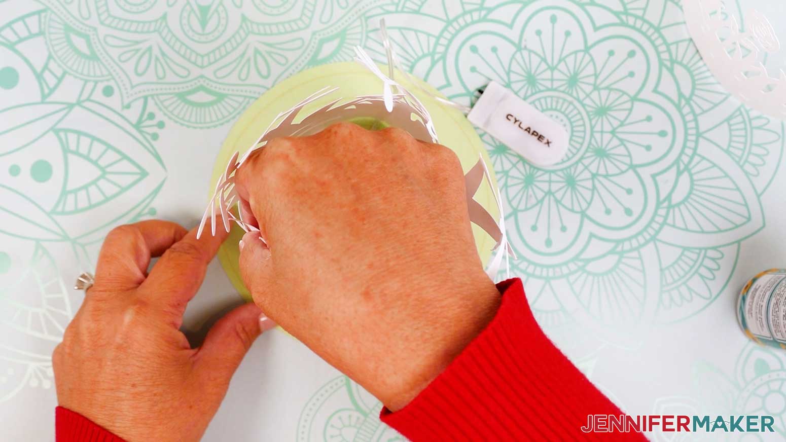 Add a dot of glue to the bottom of the remaining tabs and press them into place on the base.
