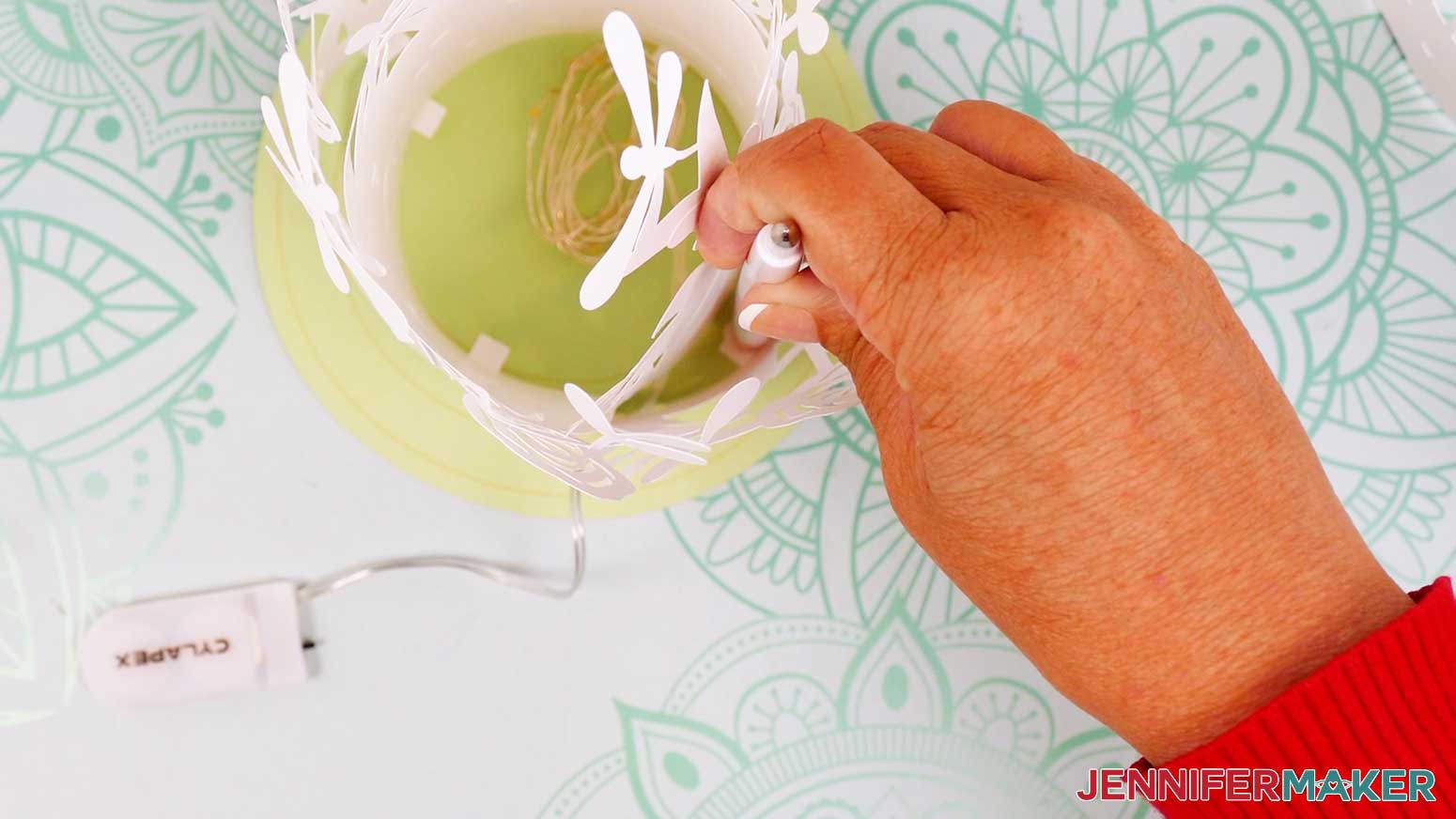 Apply glue to the first tab of the middle layer and press it in to place.