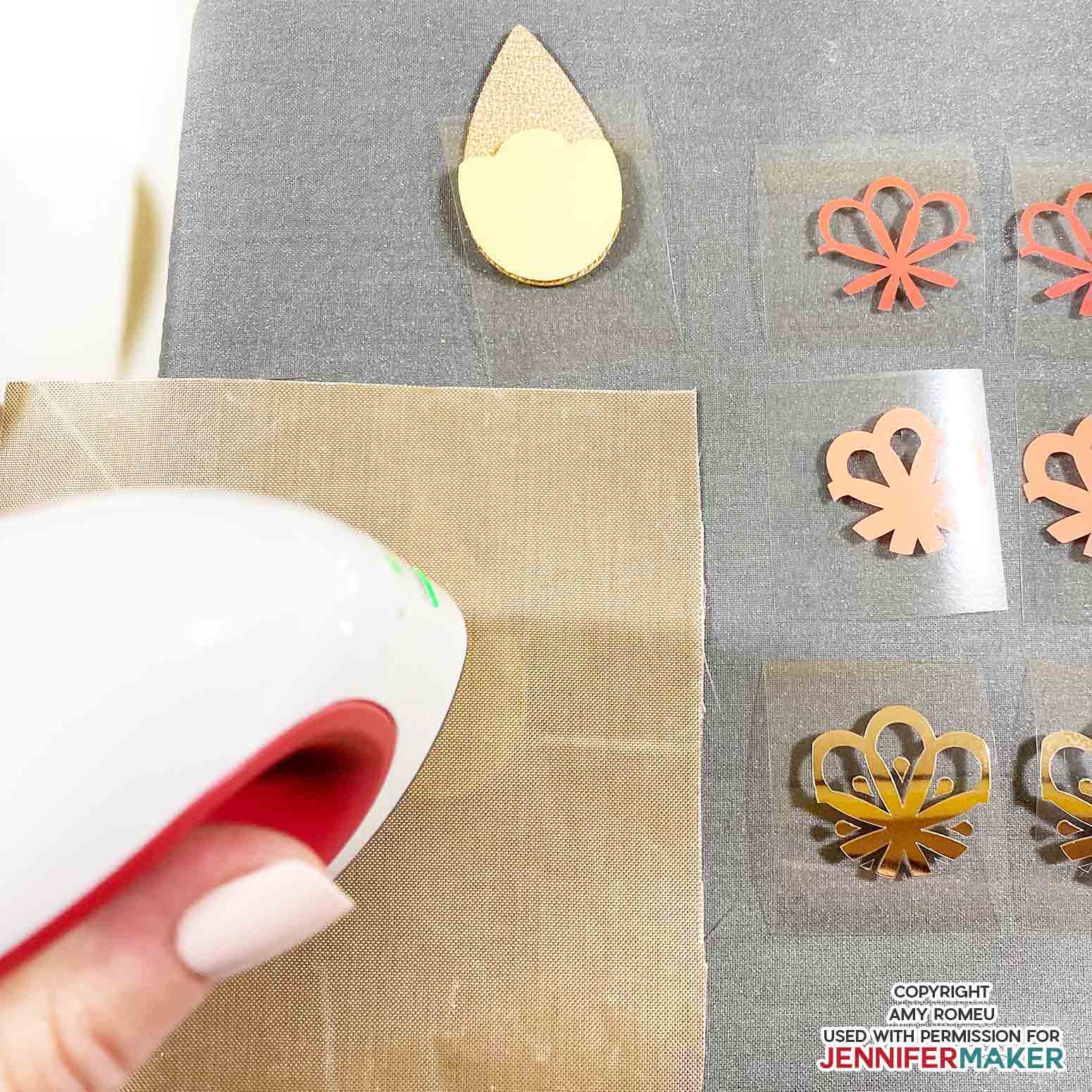 heat pressing vinyl earring shape layers onto faux leather