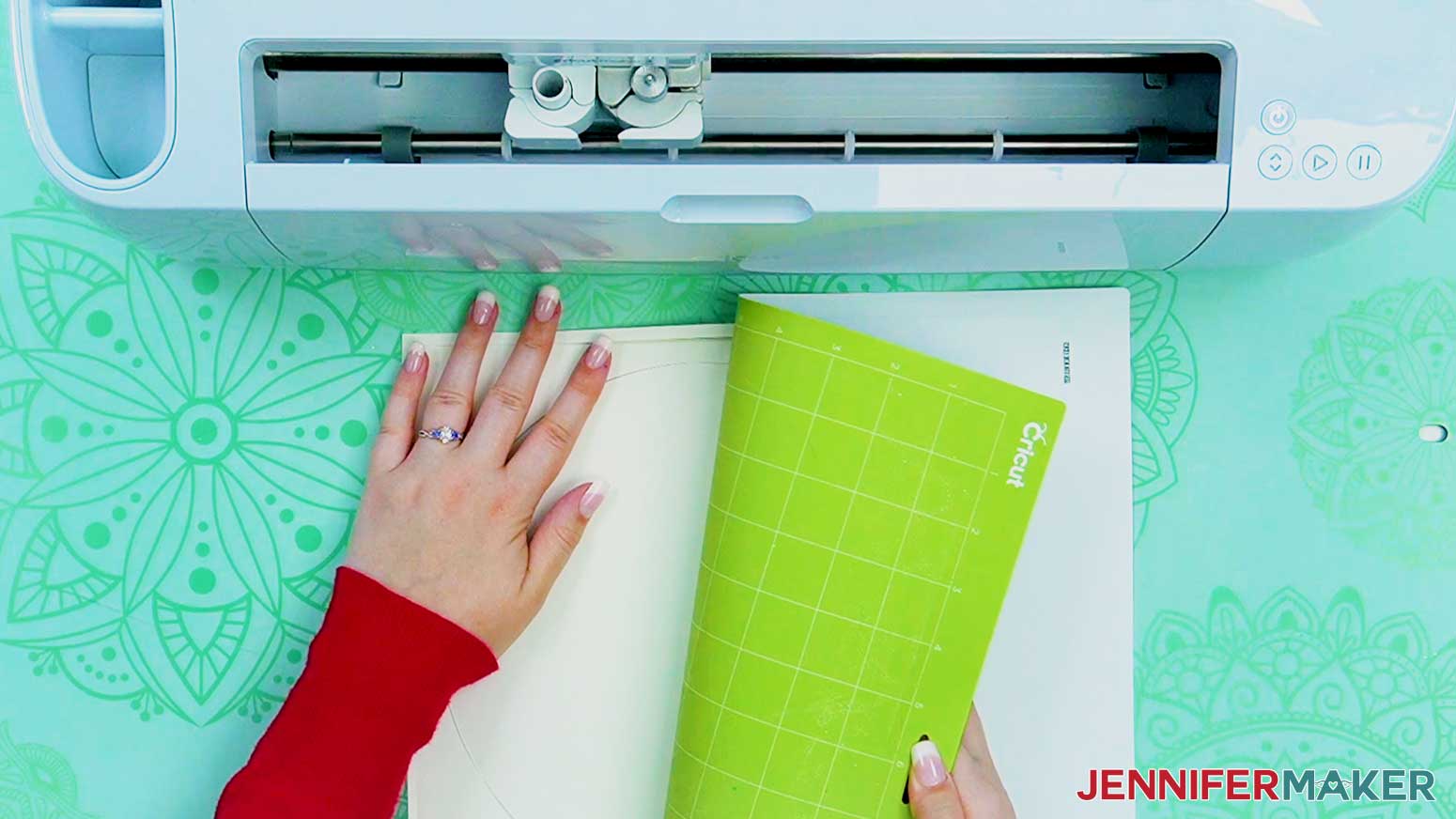 Roll the cut file off the machine mat by turning it over and pulling the mat away from the cardstock.