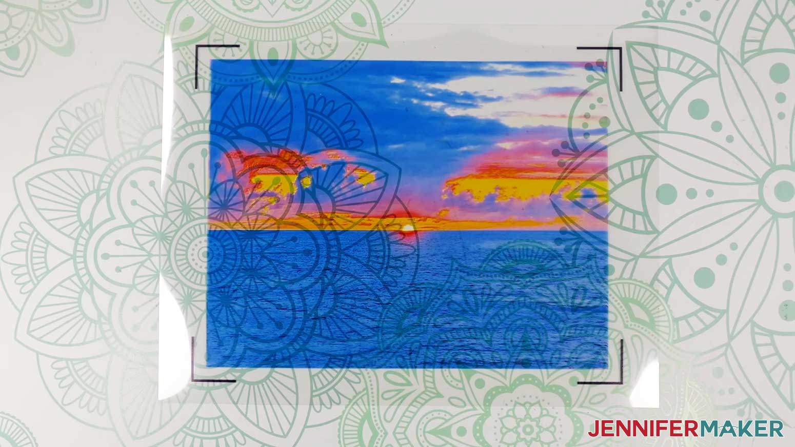 Printed sunset photo on transparency film with Print Then Cut registration marks for the light painting shadow box