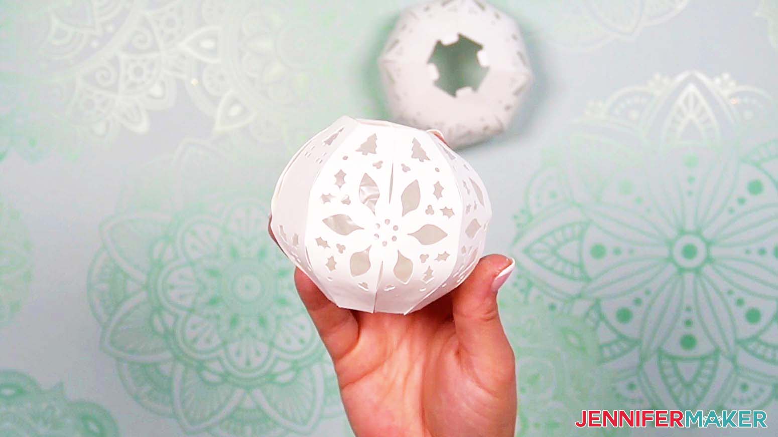 Once all the tabs are attached, the light up snowman's head pieces will form a sphere shape