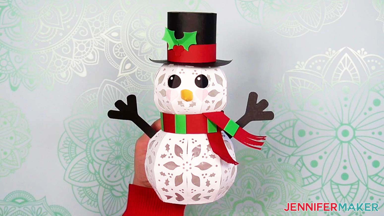 Glue the stripes to the light up snowman's scarf and fluff the tassels at the ends