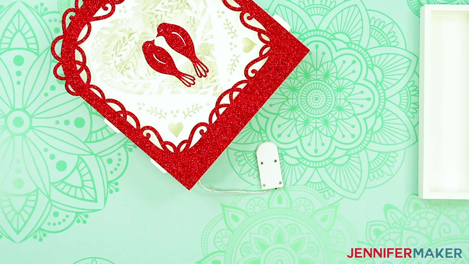 Access the fairy lights battery pack inside the completed love paper lantern