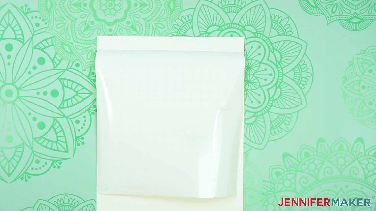 Attach vinyl to the back of cardstock to make an intricate love paper lantern