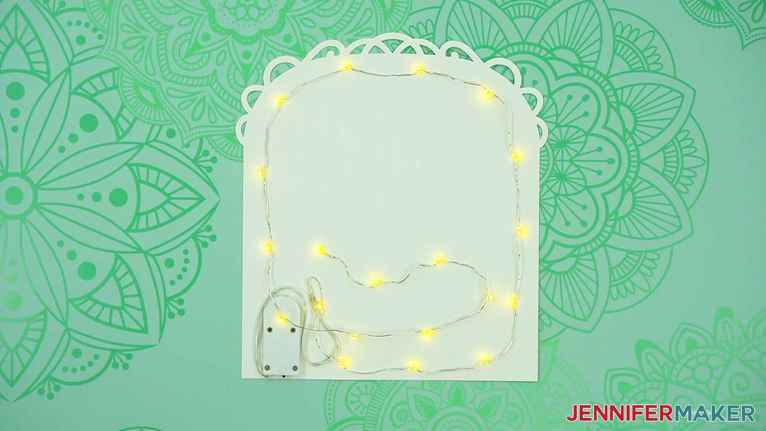 Fairy lights adhered to the back piece of the love paper lantern