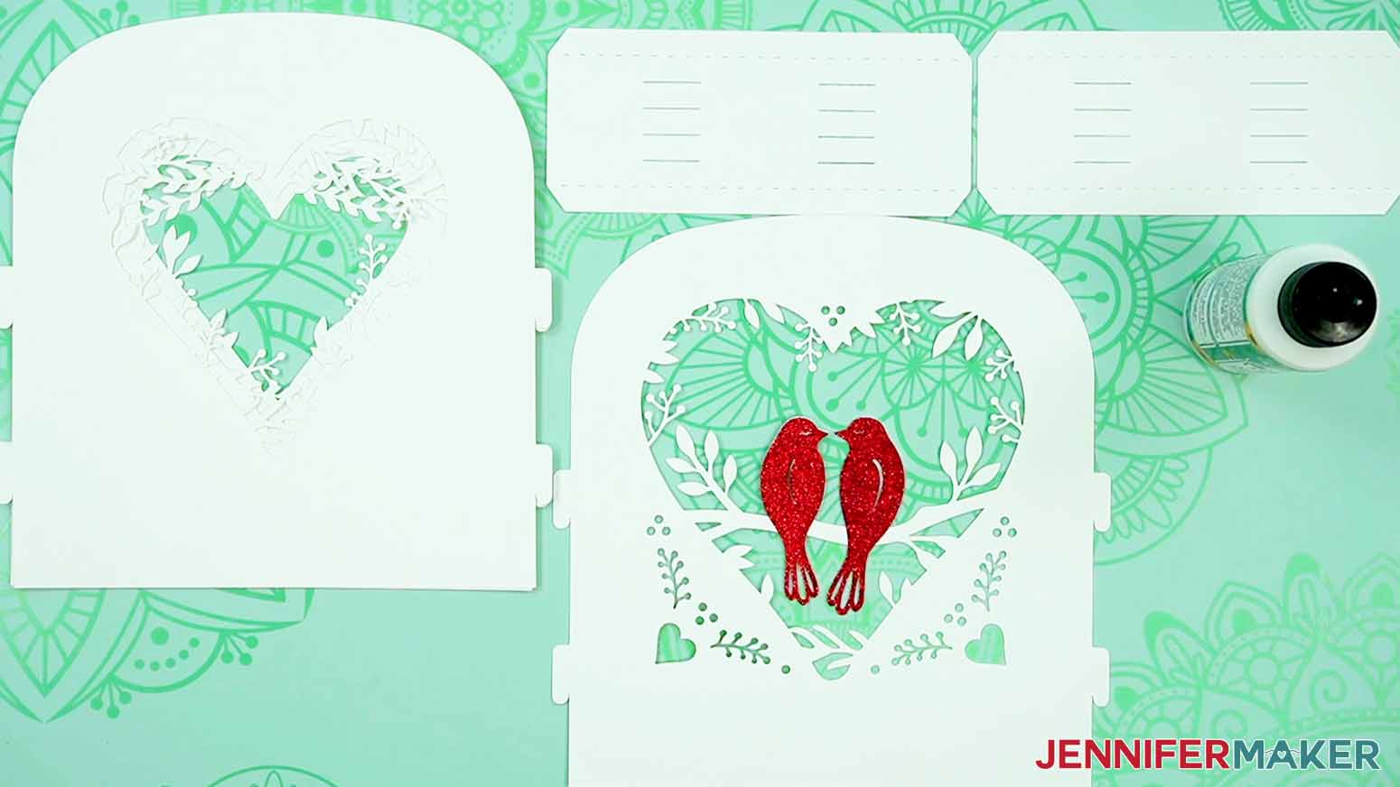 Secure the optional glitter bird silhouettes to make a love paper lantern