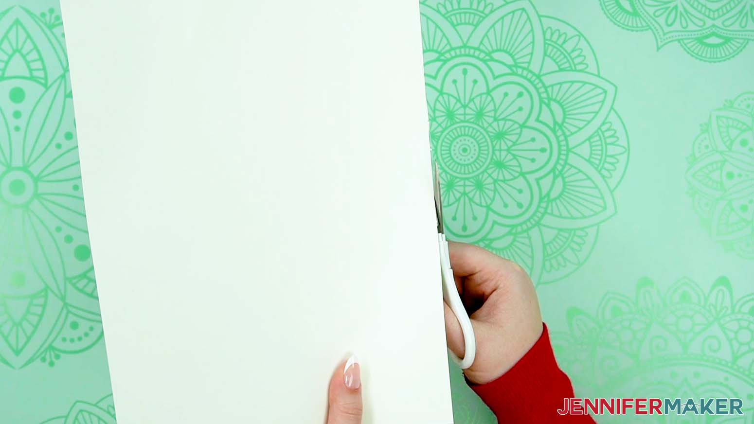 Cut off excess vinyl around the edges of the cardstock to make a love paper lantern