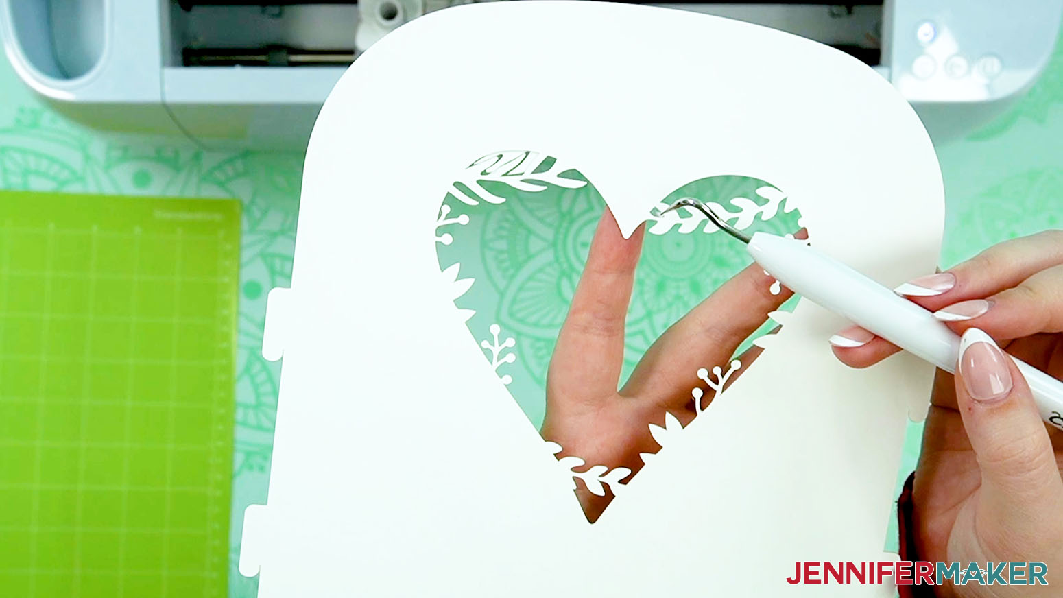 Use a weeding tool to push small pieces of paper out to make an intricate love paper lantern