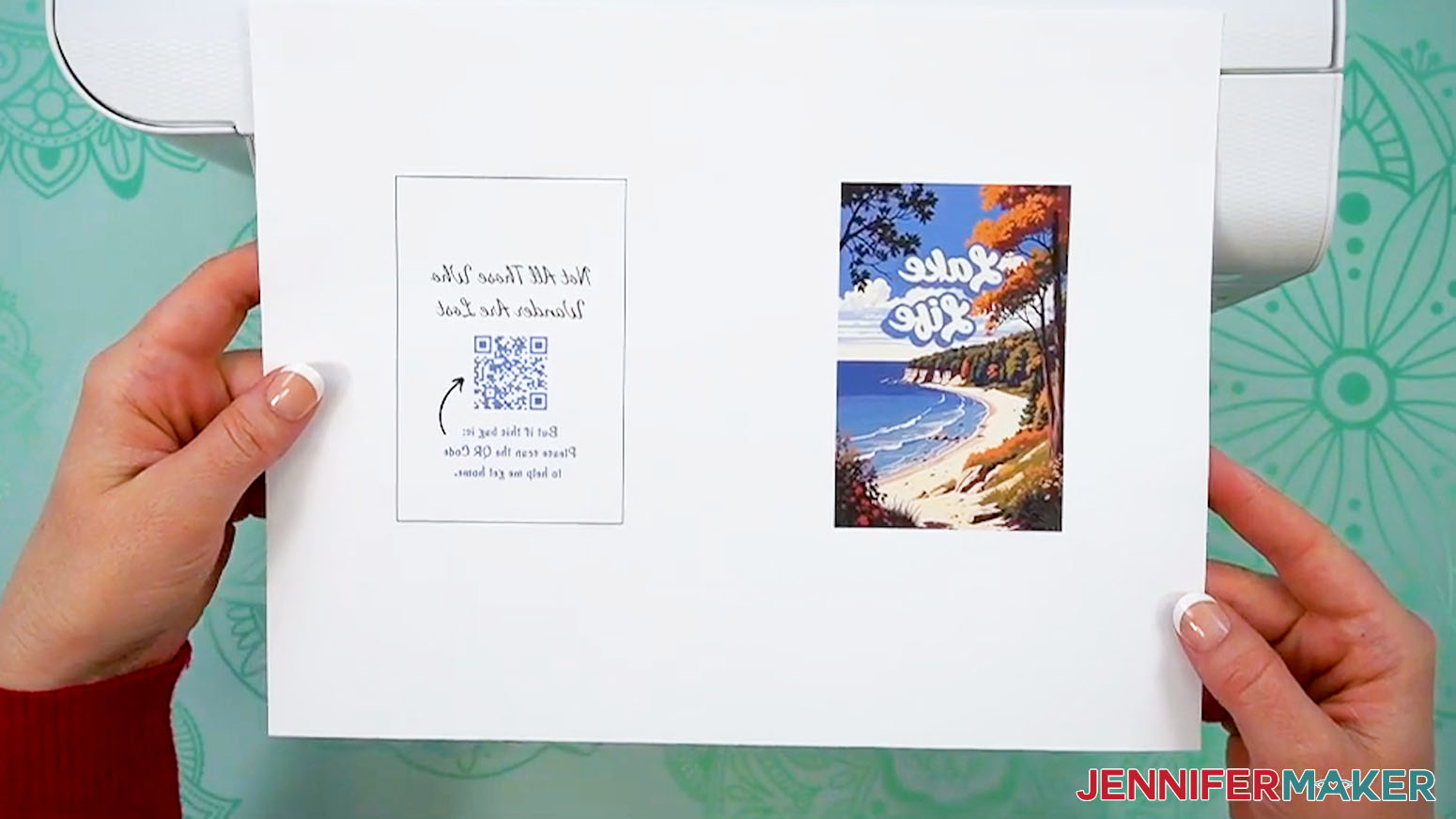 Hands hold a piece of dye sublimation paper printed with the luggage tag images that have been printed mirrored.