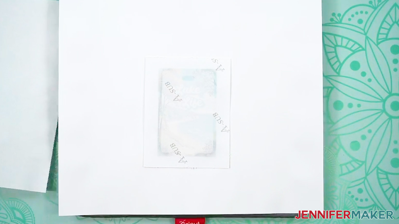 The blank has been heated and the dye sublimation paper is backside up and shows signs of the heating.