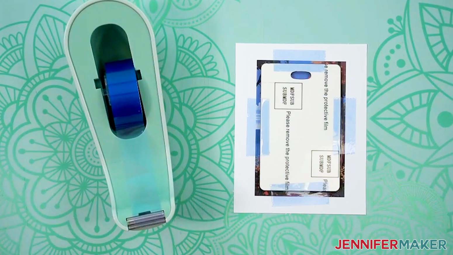The dye sublimation luggage tag blank has been taped to the printed paper.