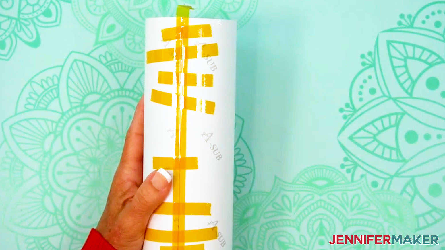 Place a long piece of tape down the entire seam of the sublimation tumbler design.