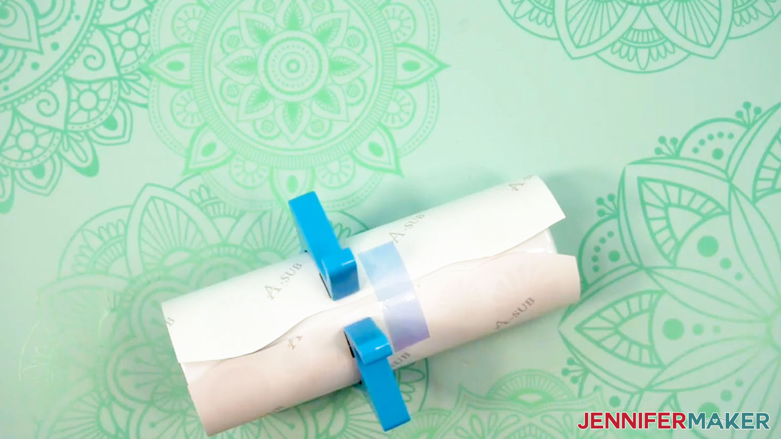 Press the middle piece of tape securely across the uneven seam of the sublimation design tumbler.