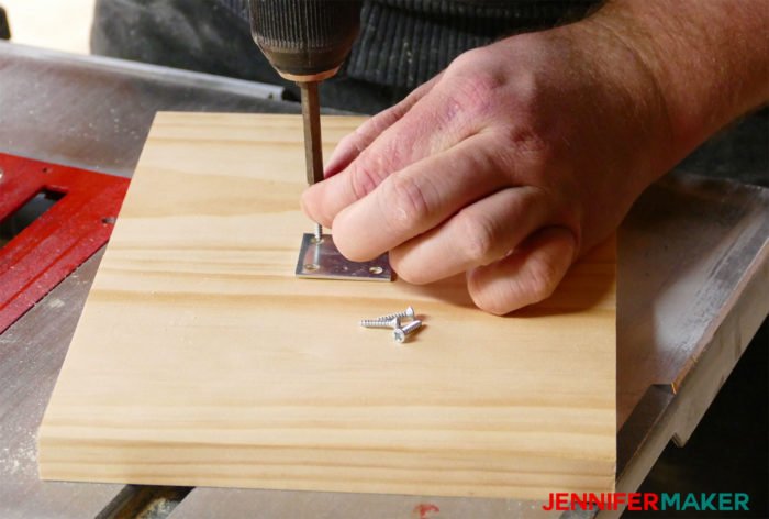 Attaching the birdhouse base together with a metal bracket