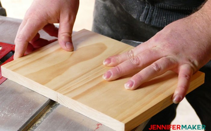 Gluing the birdhouse base together with wood glue