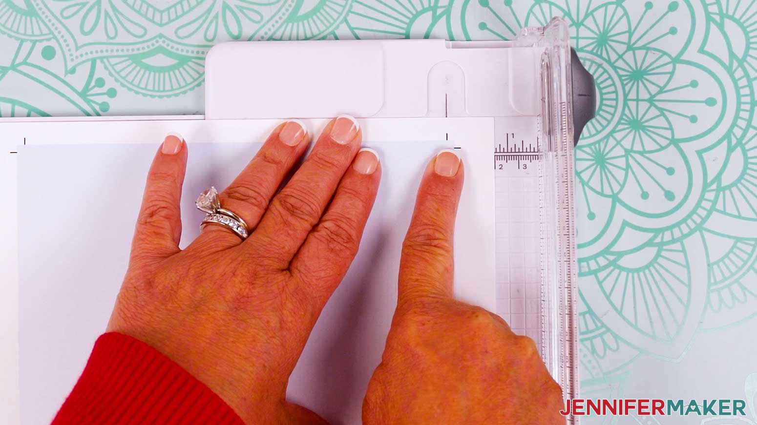 Align the crop marks in the paper trimmer.
