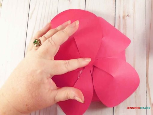 Glueing large petals to the bottom of the giant paper flower