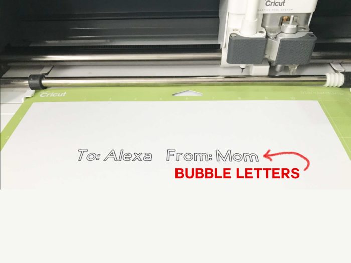 The dreaded bubble letters made by a Cricut pen when preparing gift tags on a Cricut