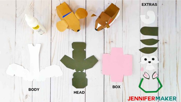 The paper pieces and materials you need to make paper dog boxes