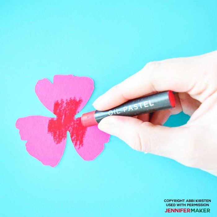 Color the paper petals with oil pastels to make paper poppies