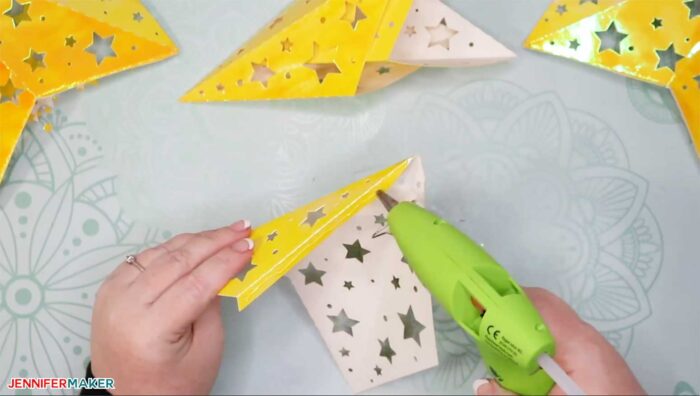 Glying a tab to make paper star lanterns
