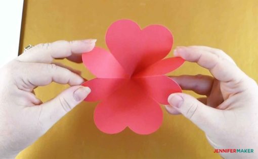 Folding the heart piece into itself to make the pop up heart rainbow card