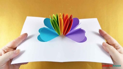 Opening up the pop-up heart rainbow card