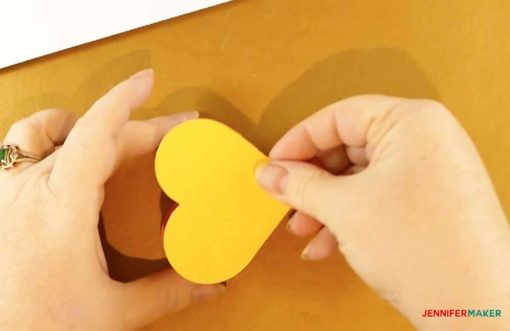 Placing a heart on top of a glued heart