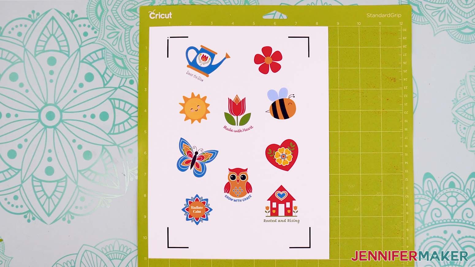 The sticker sheet from Canva is printed and face up on the Green Cricut mat.