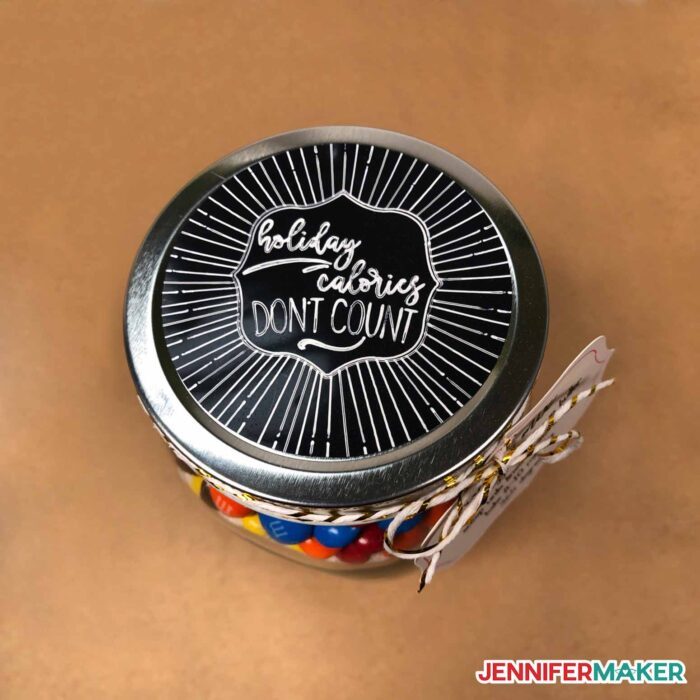 Decorative written sunburst label on black writable vinyl made using the mason jar gift ideas tutorial.