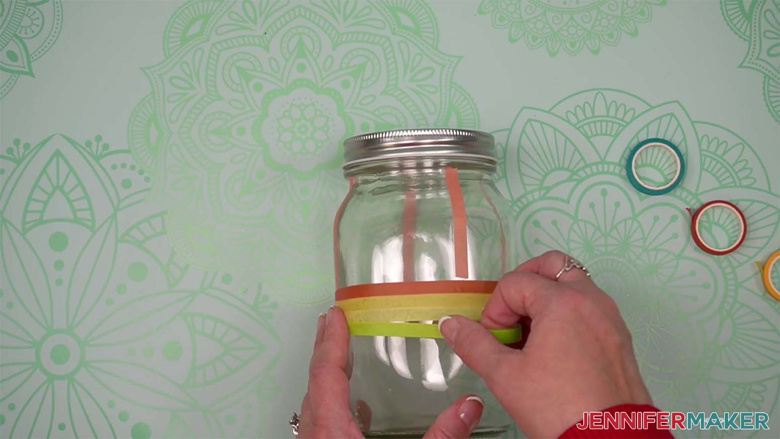 adding additional rows of washi tape to mason jar