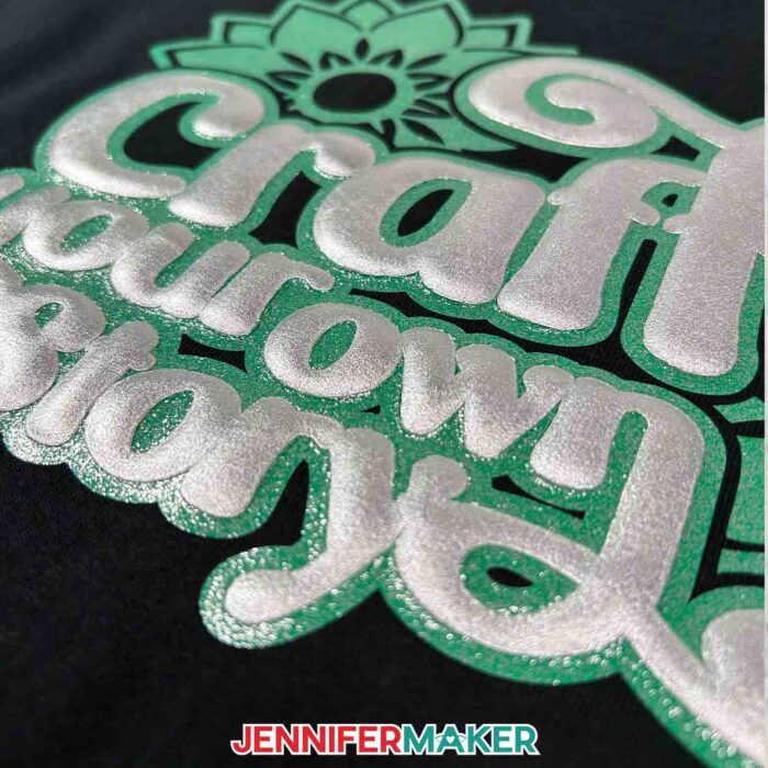 Extreme close-up of green glitter vinyl and silver puff vinyl on a T-shirt, showing the dimension, as part of the Puff Vinyl Tutorial