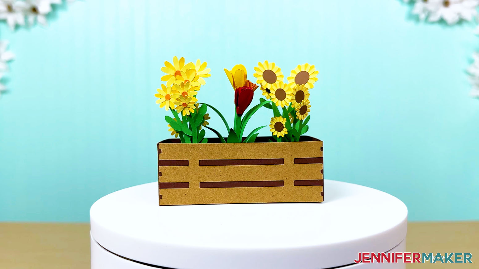 Assembled crate with daisies, tulips, and sunflowers on display.