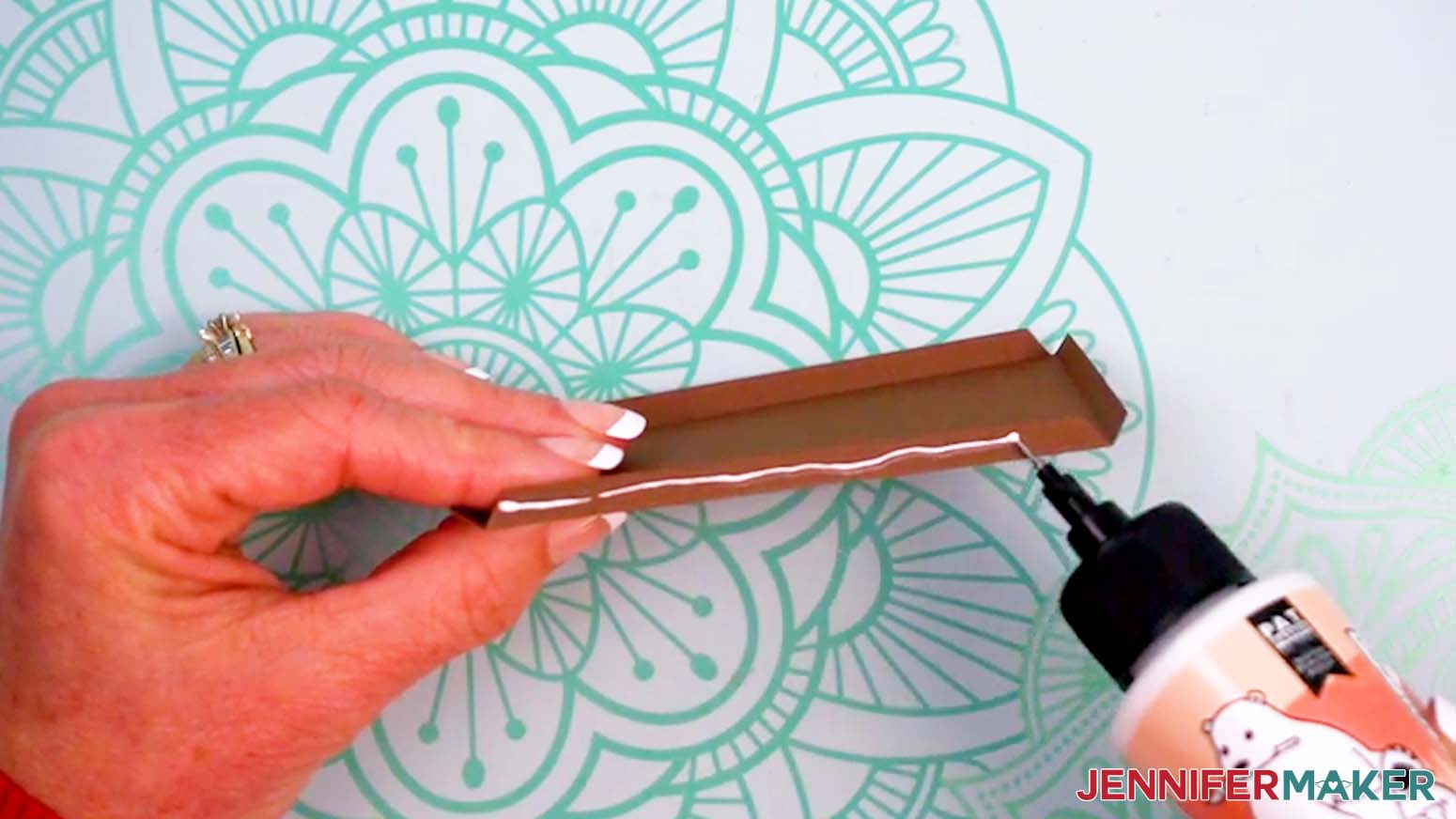 Apply glue along a long bottom tab.