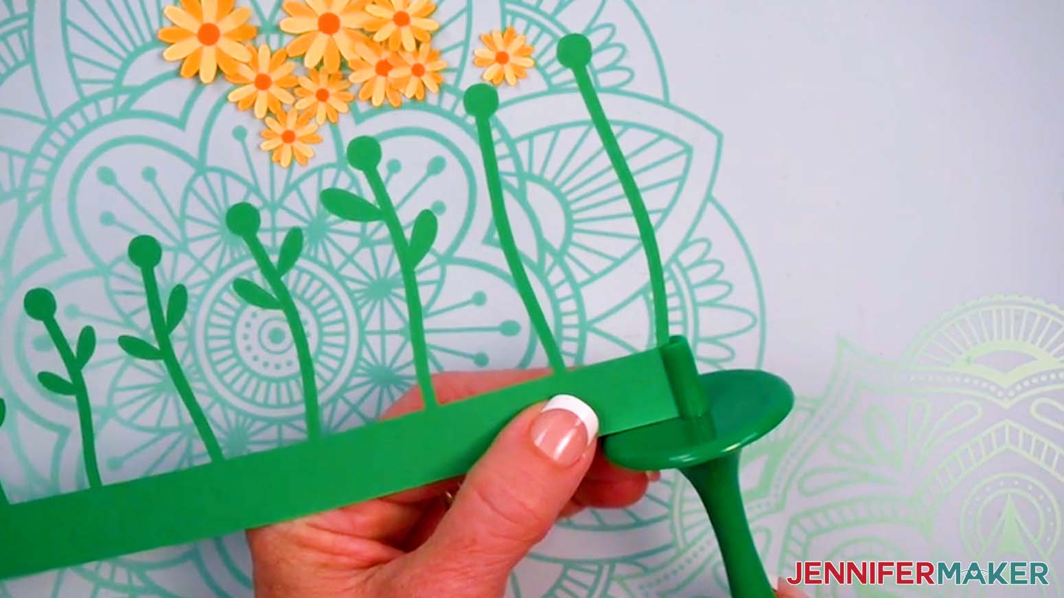 Insert the tall end of the daisy stems into the Flowtool.