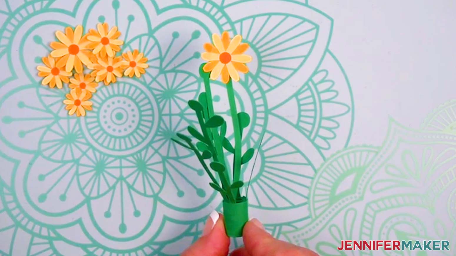 Glue a large daisy on the tip of the tallest stem.