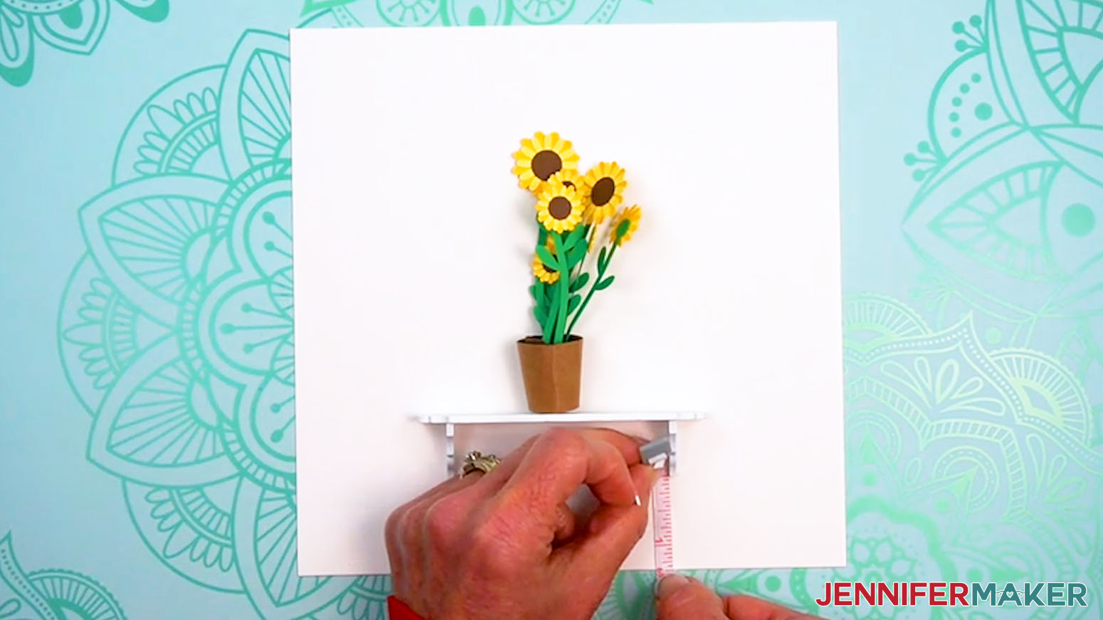 Measure the distance of the shelf supports to the bottom of the cardstock.